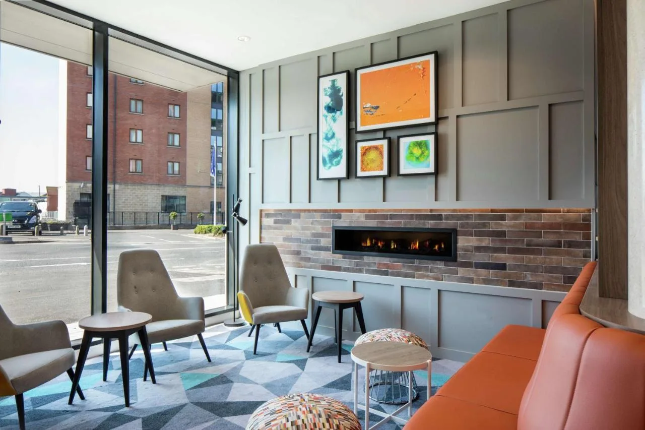 Lounge with armchairs and a fireplace