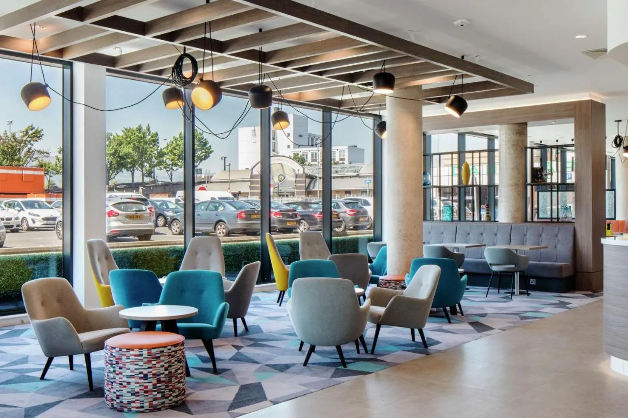 Bright lobby with chairs, tables and windows